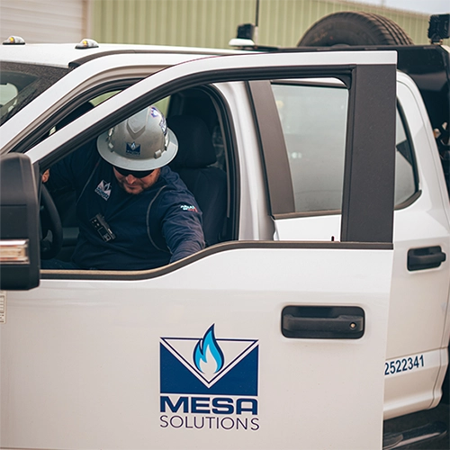 Mesa Generator Technician arriving at a job site in work truck.